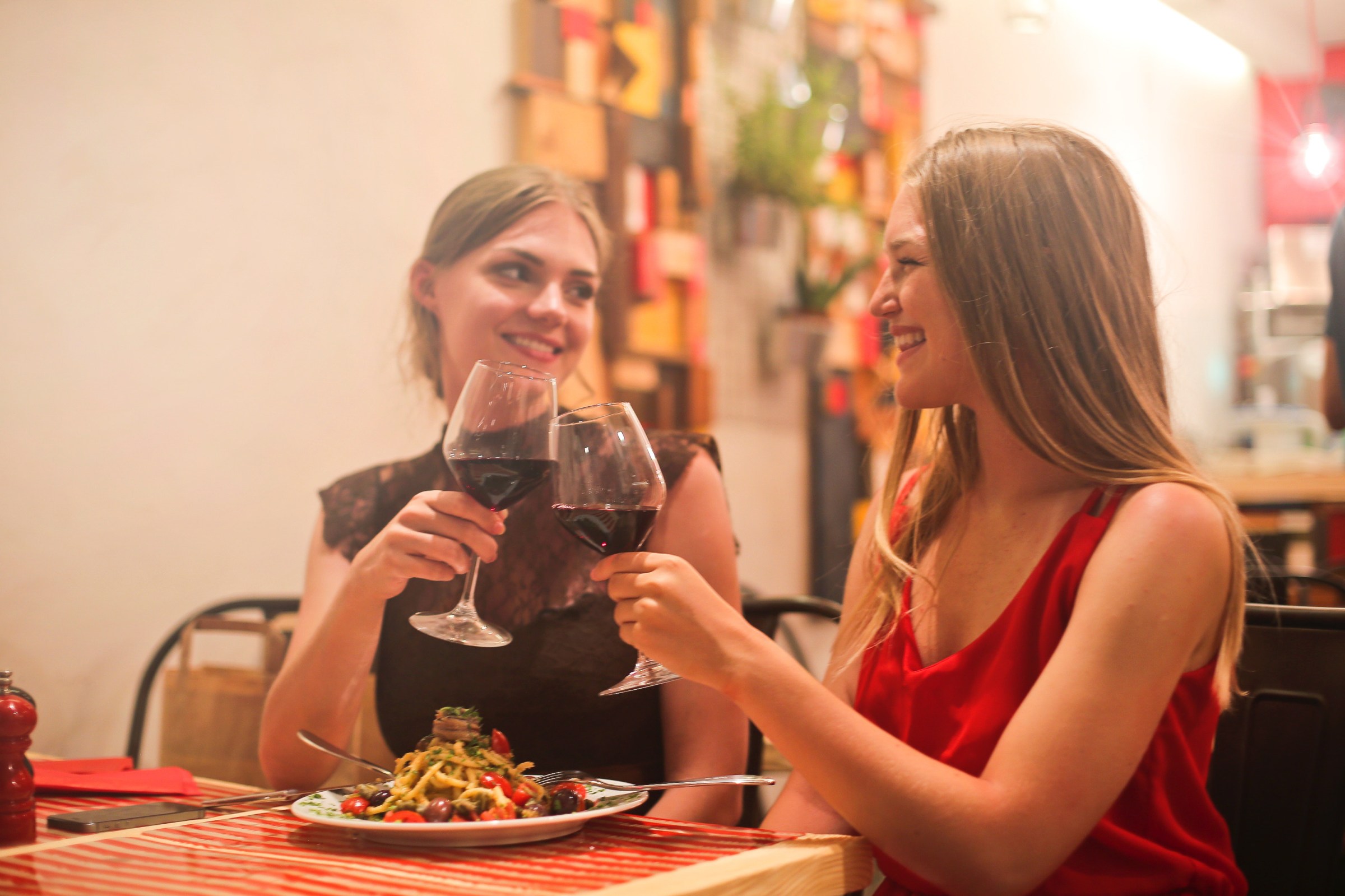 Women drink vine inside